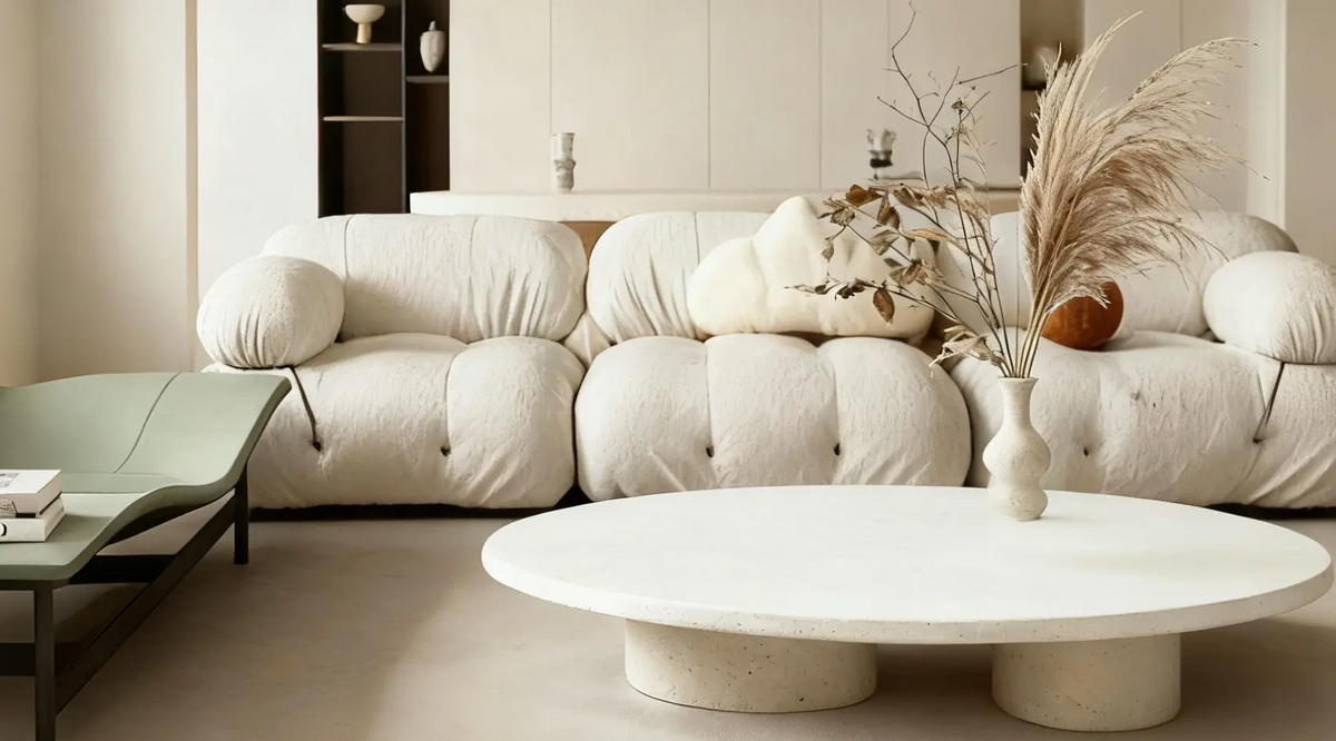 Modern living room featuring white ceramic vase on coffee table