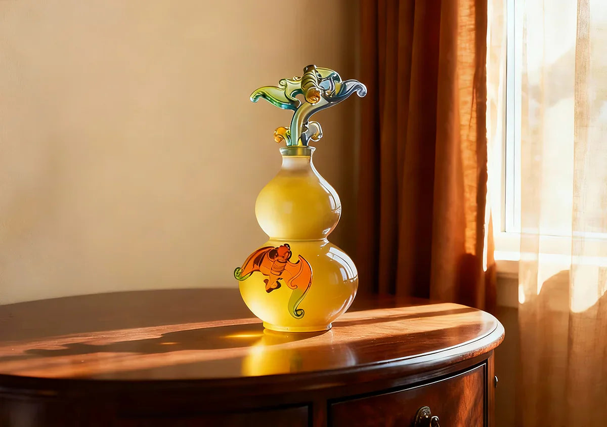 Luxury amber Liuli crystal gourd sculpture on a wooden console table, glowing in natural light, representing high-end Feng Shui home decor.