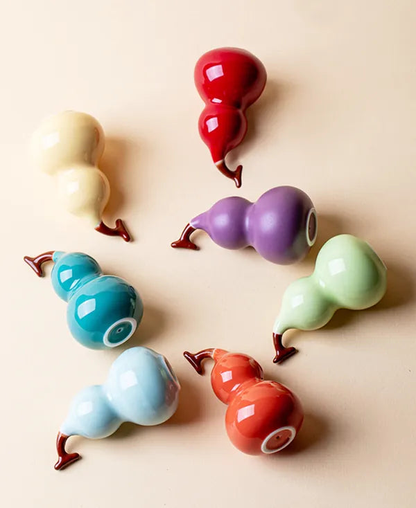 Top-down view of the complete Mini Energy Series porcelain sculptures in 7 distinct glossy colors for color therapy.