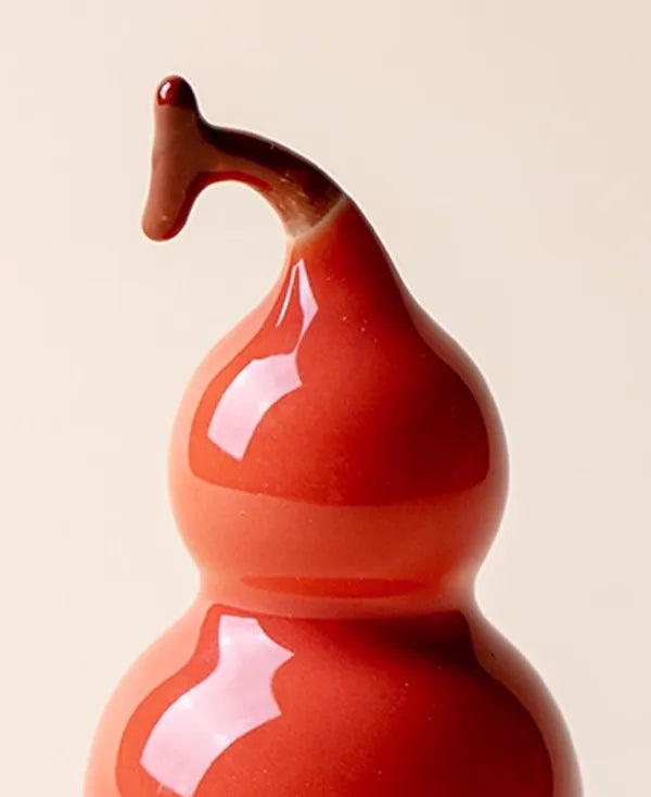 Single Red glazed porcelain desktop ornament standing upright, symbolizing vitality and passion for modern decor.