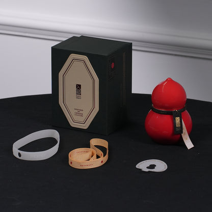 Premium candle gift set packaging including an imperial red porcelain vessel and a designer octagonal gift box for corporate or holiday gifting.