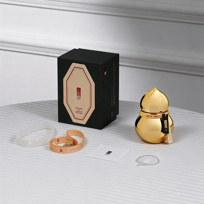 Luxury candle gift set with premium black packaging and a gold-plated porcelain vessel, ideal for high-end corporate or prosperity gifts.